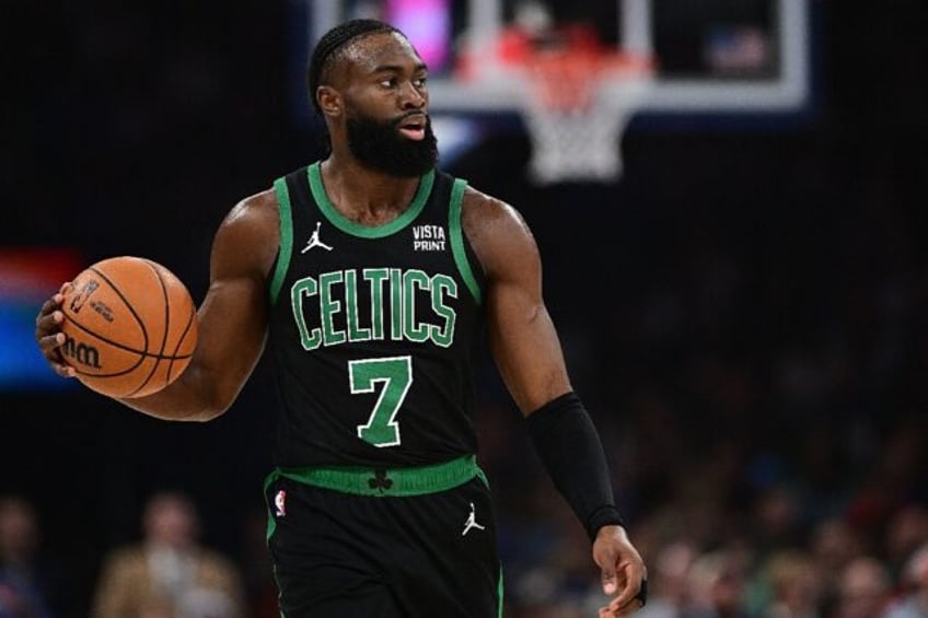 Jaylen Brown scored 32 points to lead the NBA-best Boston Celtics over visiting Houston, keeping the Celtics unbeaten at home by defeating the club guided by former Boston coach Ime Udoka