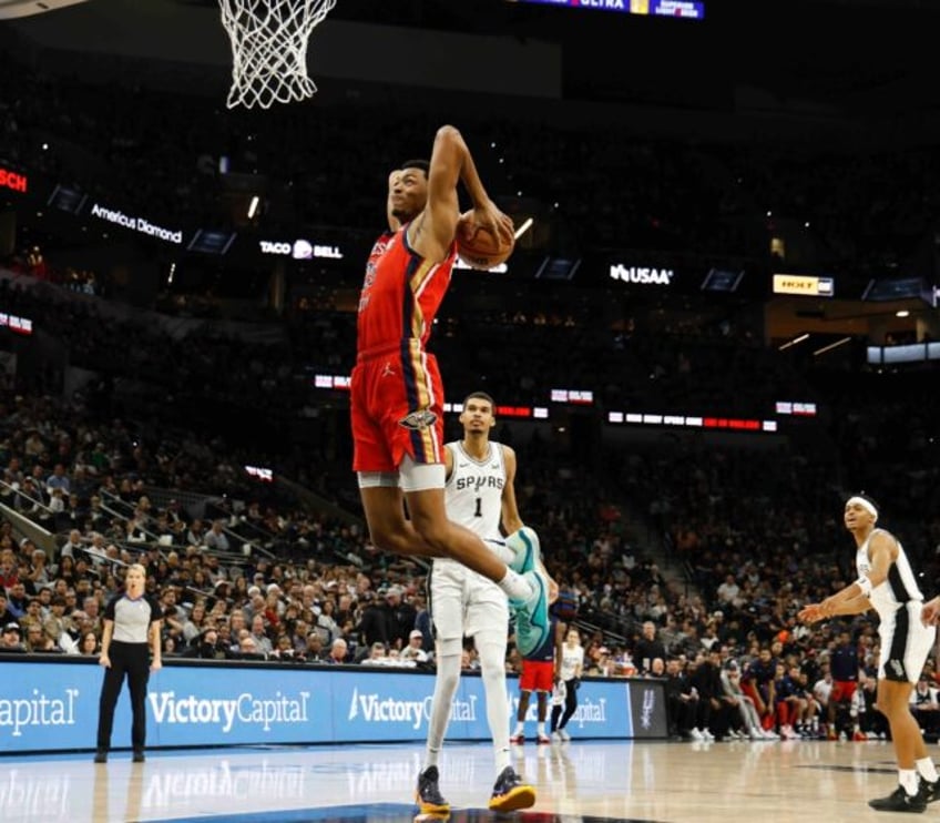 Trey Murphy III of the New Orleans Pelicans throws down a dunk in his team's NBA victory over the San Antonio Spurs