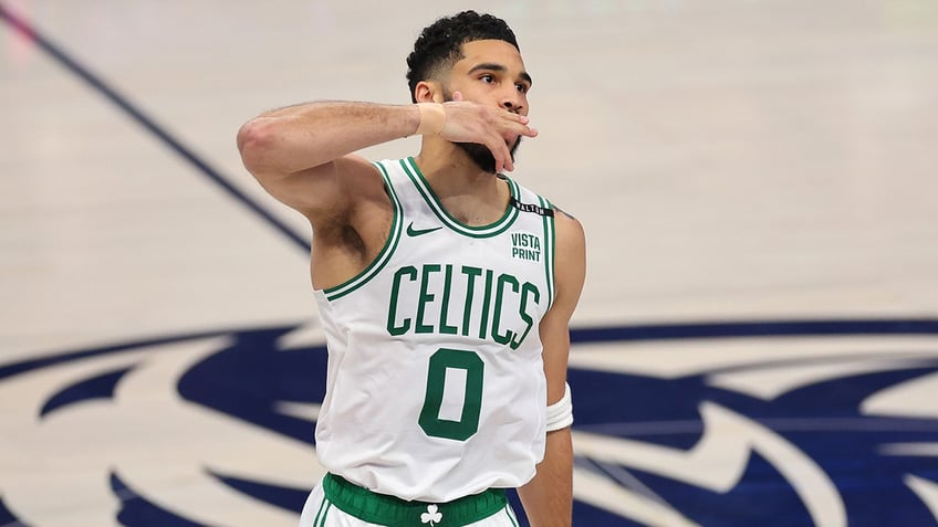 Jayson Tatum kisses fans goodbye