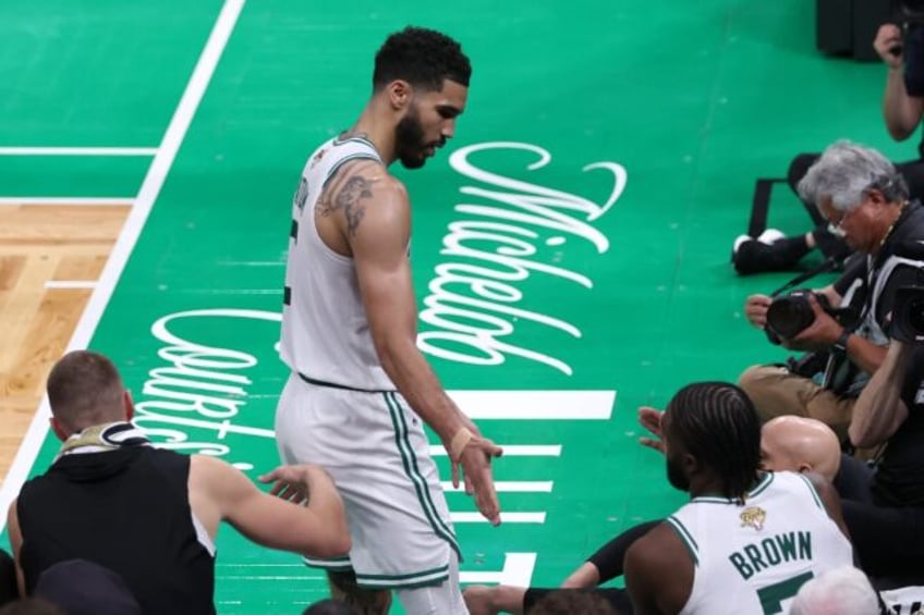 Boston's Jayson Tatum high fives teammate Jaylen Brown during the fourth quarter of the C