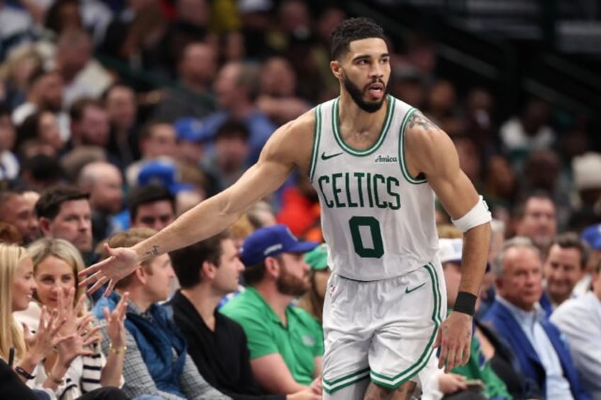 Boston star Jayson Tatum reacts after scoring during the Celtics' NBA victory over the Dal