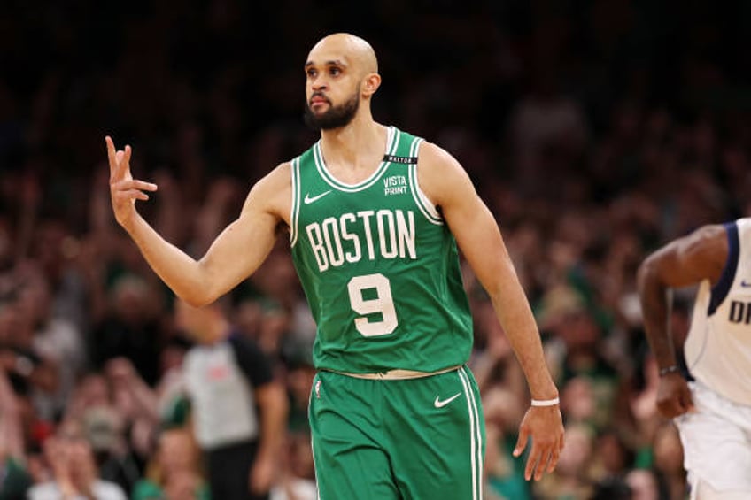 Derrick White of the Boston Celtics celebrates after a three point basket against the Dallas Mavericks during the fourth quarter of Game Five of the...