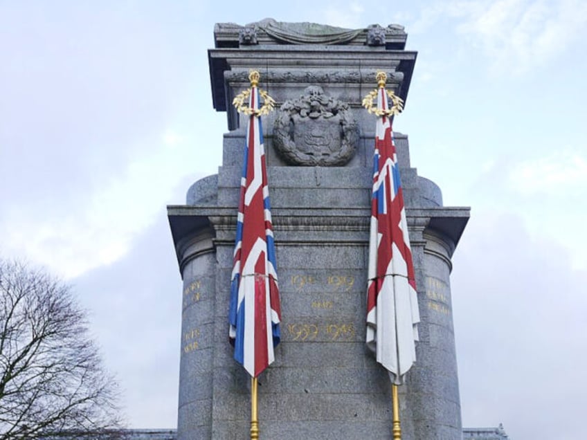 cenotaph war memorial defaced with free palestine graffiti in rochdale