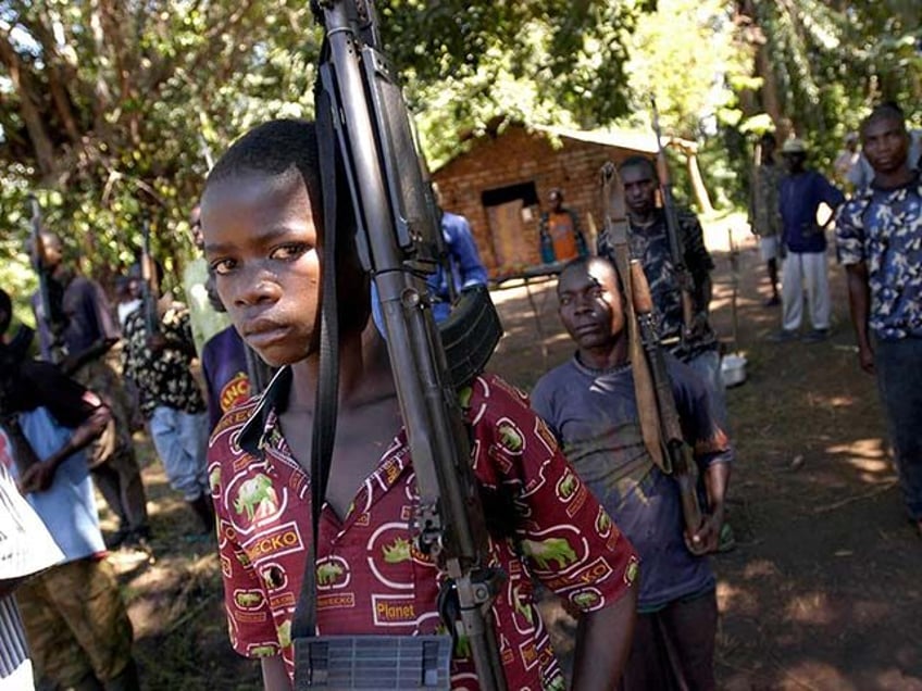 Young militiamen of the RCD (Congolese Rally for Democracy) and of Mai-Mai groups attend a