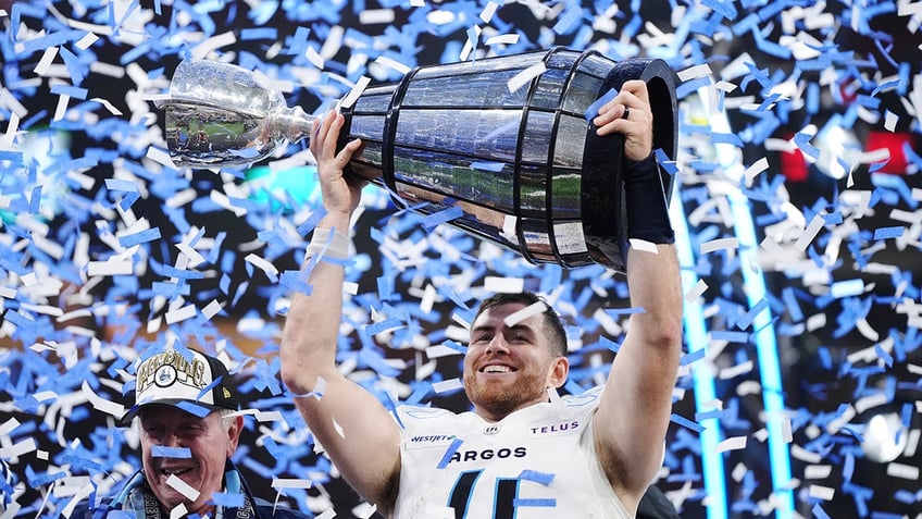 Nick Arbuckle holds the Grey Cup