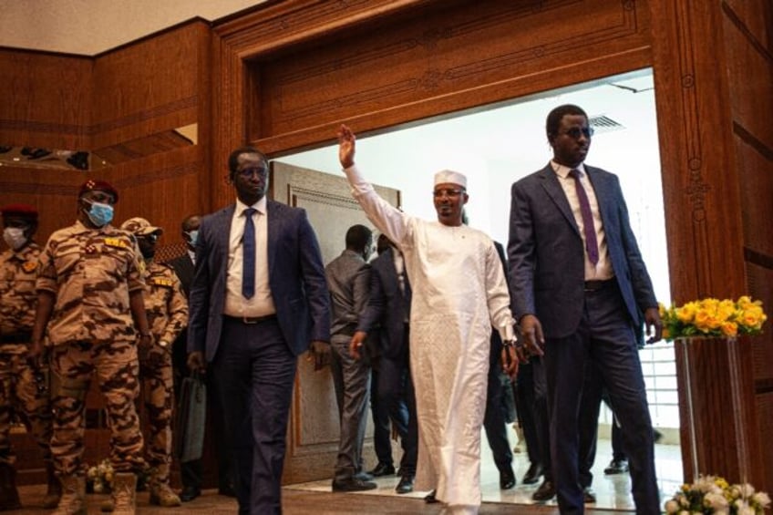 Chadian junta leader Mahamat Idriss Deby Itno (C) took power after his father's death