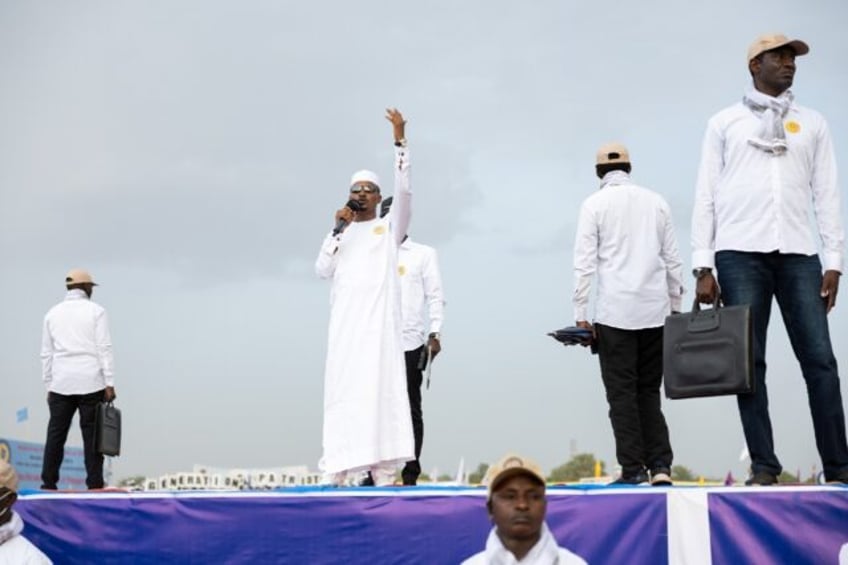 Chad ruler Mahamat Idriss Deby Itno hails the crowd at a campaing rally in Moundou, Dombao