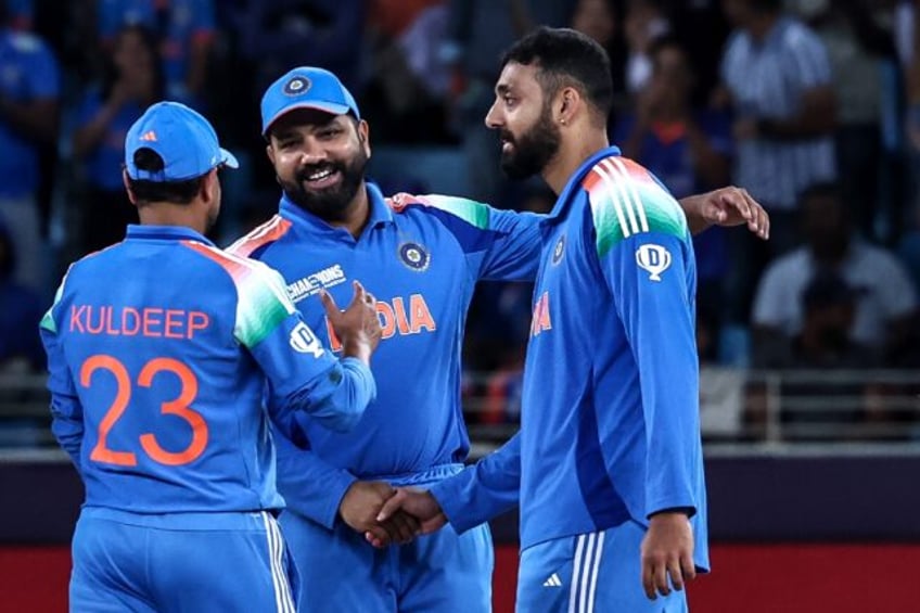 India's Varun Chakravarthy (R) took five wickets against New Zealand