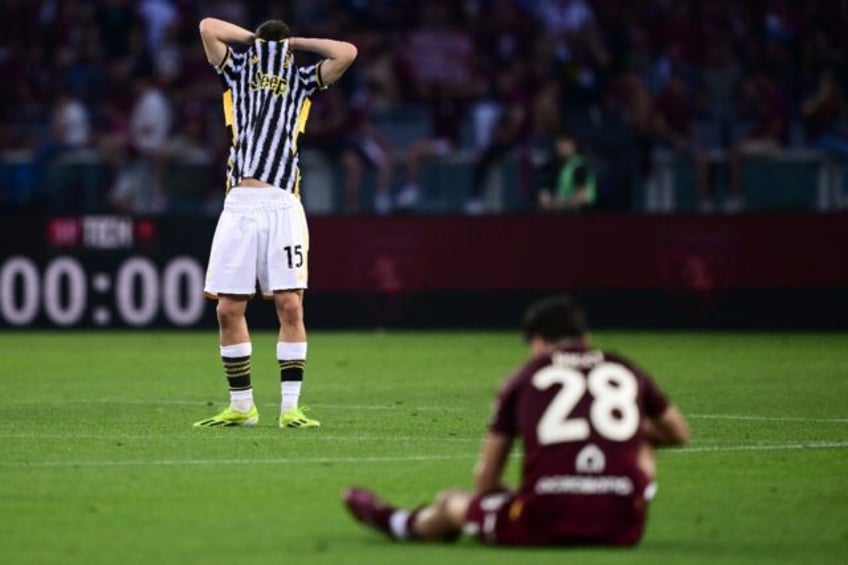 Juventus attacker Kenan Yidliz (L) shows his frustration as Samuele Ricci of Torino takes