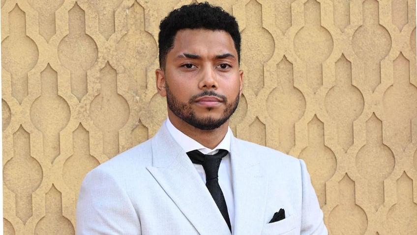 chance perdomo staring into camera on red carpet