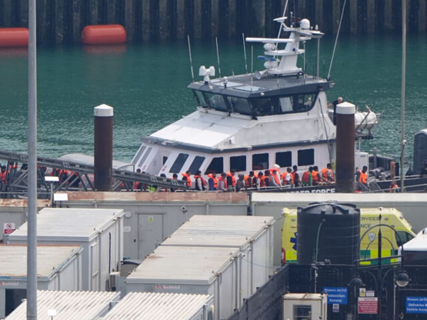 A group of people thought to be migrants are brought in to Dover, Kent, from a Border Forc