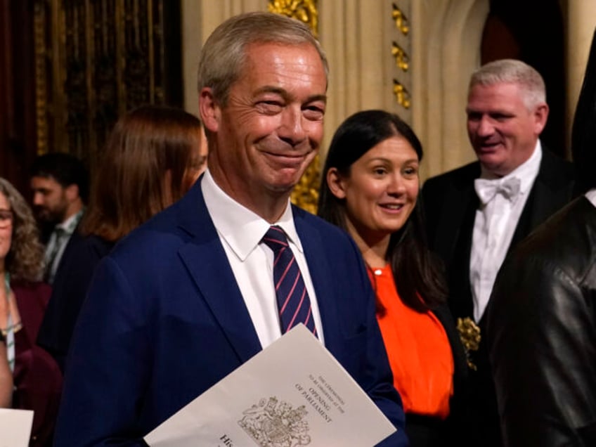 Reform UK leader Nigel Farage walks from the House of Lords after hearing the King's