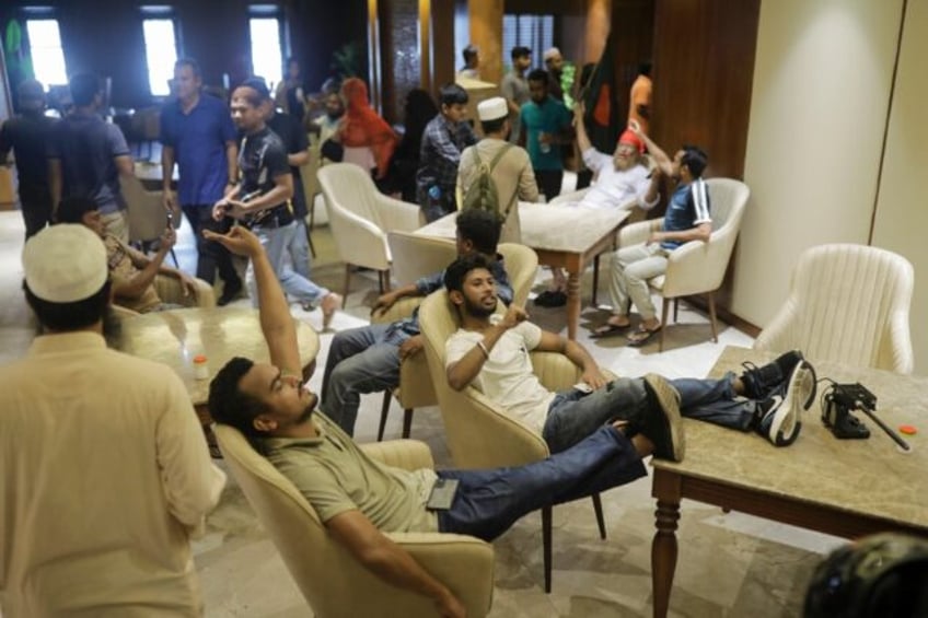 Anti-government protesters lounged inside former prime minister Sheikh Hasina's palace in