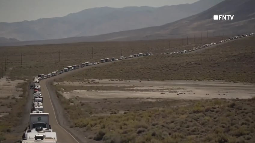 chaotic video shows police breaking up burning man climate protest blocking road and causing traffic jam