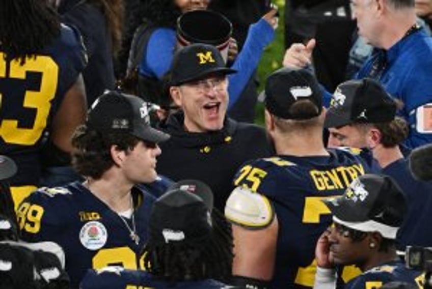 Chargers to hire Michigan's Jim Harbaugh as new coach