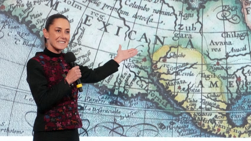 Claudia Sheibaum with map