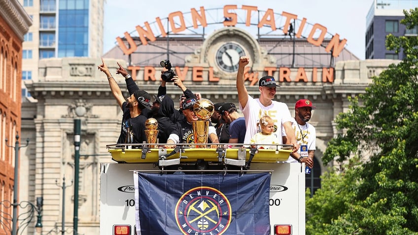 Jamal Murray and Nikola Jokic celebrate at the championship parade