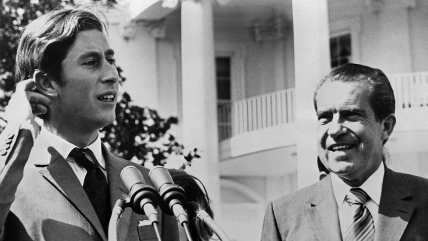 Richard Nixon admiring Prince Charles at the podium