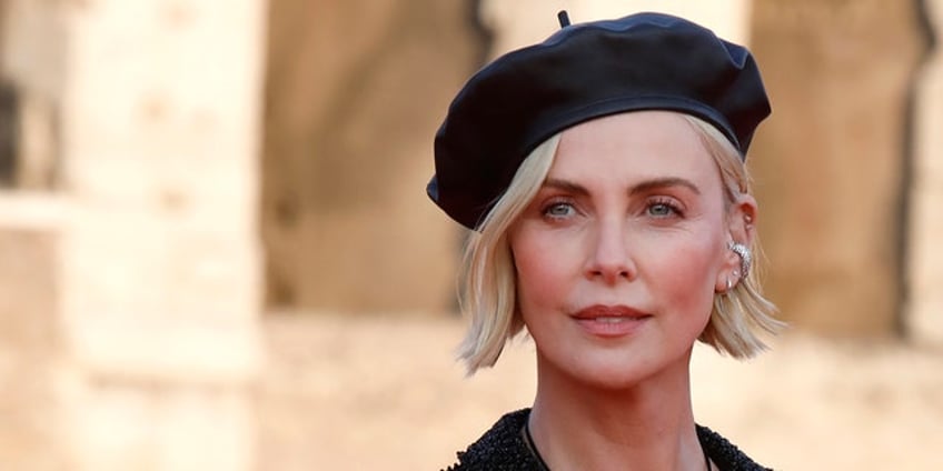 charlize theron shuts down rumors she had bad plastic surgery b im just aging