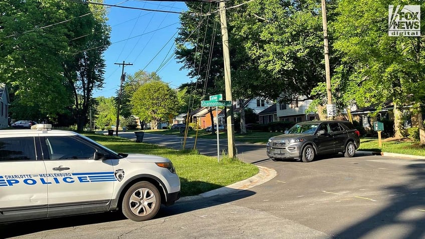 Police car parked in suburban neighborhood during Charlotte shooting