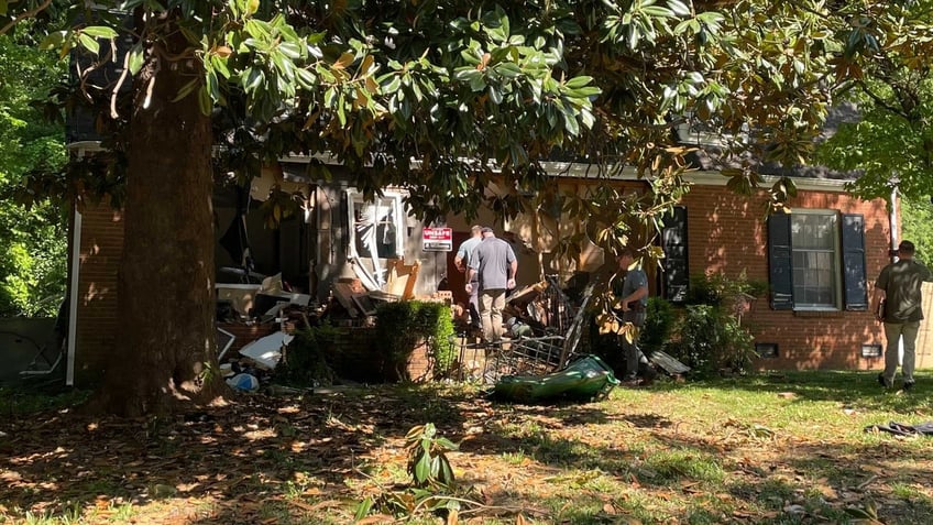 Investigators entering the scene of a Charlotte, North Carolina, shootout on Galway Drive