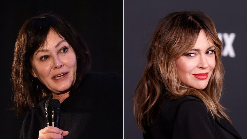 Shannen Doherty on stage wearing black holds a microphone and looks to her left split Alyssa Milano in black on the carpet looks over her shoulder to the right