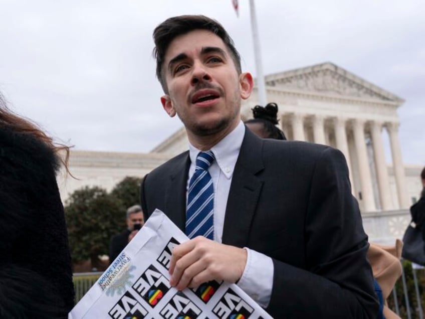 Attorney and transgender rights activist Chase Strangio speaks to supporters outside of th