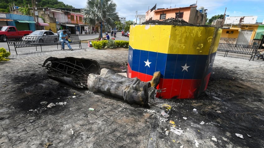 Toppled Chávez statue