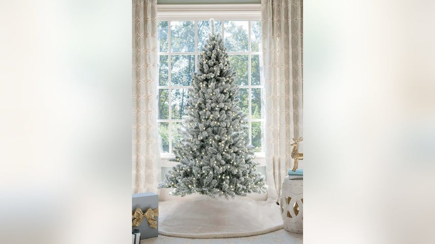 Flocked trees dusted with faux snow bring a winter wonderland vibe to your home.