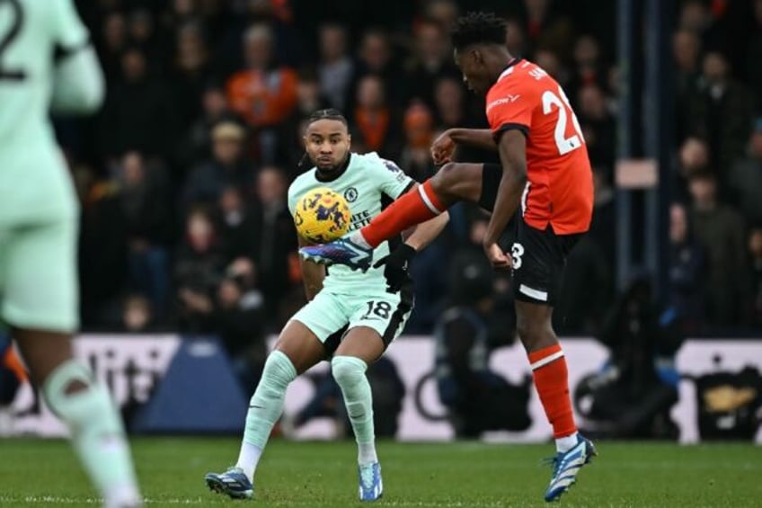 Chelsea forward Christopher Nkunku (L)