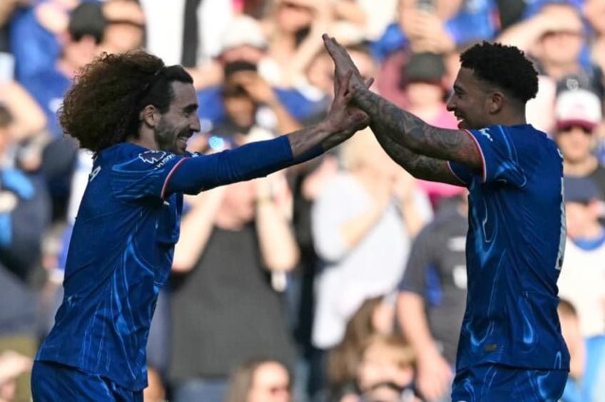 Chelsea's Marc Cucurella (L) celebrates scoring against Leicester