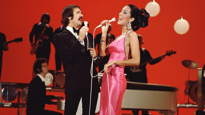 A photo of Sonny Bono and Cher singing