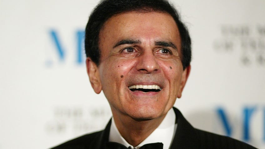 Casey Kasem smiles wearing a tuxedo