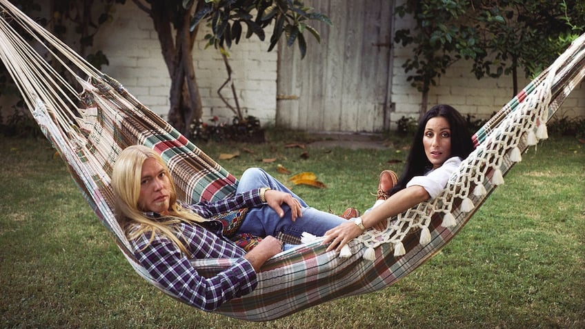 Gregg Allman and Cher on a hammock in Los Angeles, circa 1977