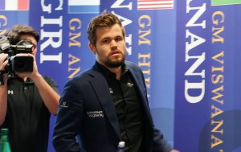 Chess champ Magnus Carlsen quits tourney after refusing to change out of jeans