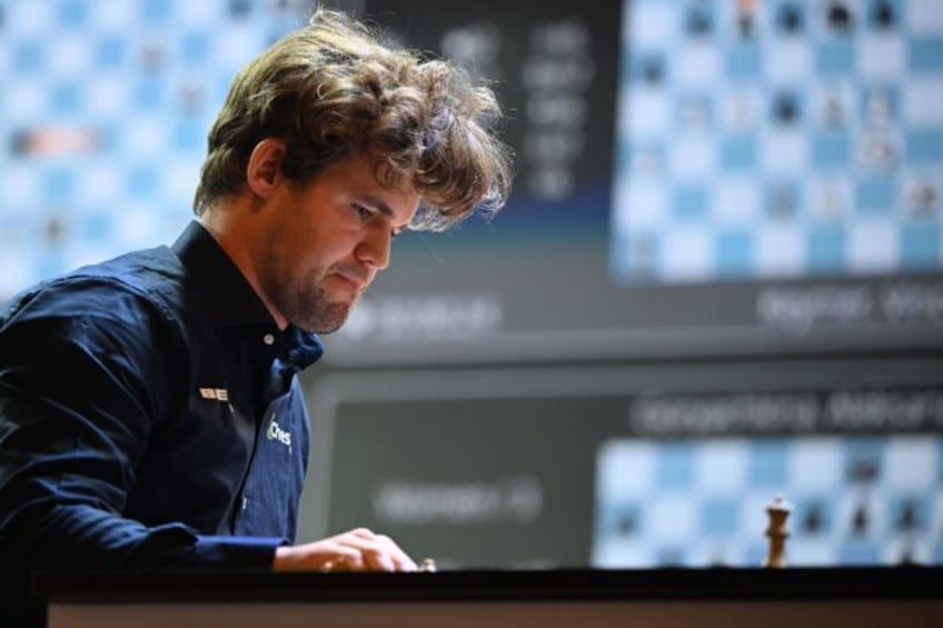Norwegian grandmaster Magnus Carlsen, pictured during a 2024 match, took on a team of 143,