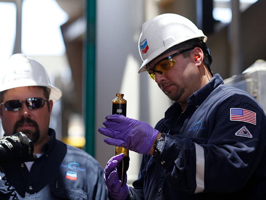 Offshore workers examine hydrocarbon samples aboard the Chevron Corp. Jack/St. Malo deepwa