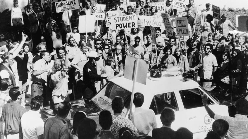 Black and white photo shows demonstrations at 1968 DNC in Chicago