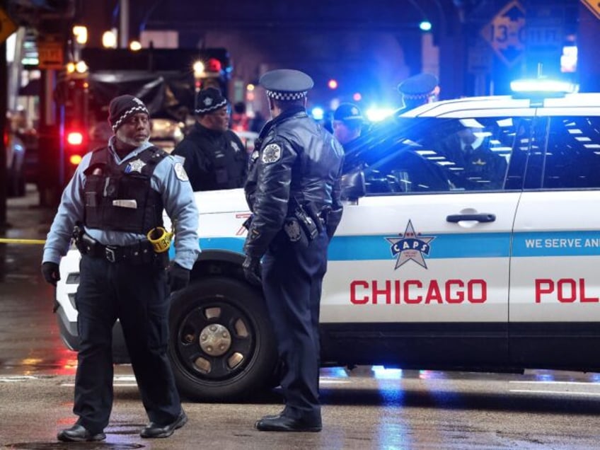 Chicago police conduct an investigation after a shooting on Wabash Avenue between Madison