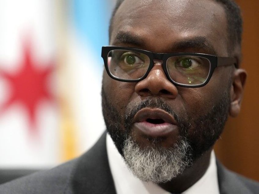 Chicago Mayor Brandon Johnson responds to a question in his City Hall office during an int