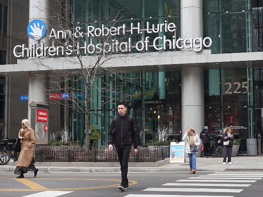 Pedestrians walk past an entrance to the Lurie Children's Hospital on February 07, 20