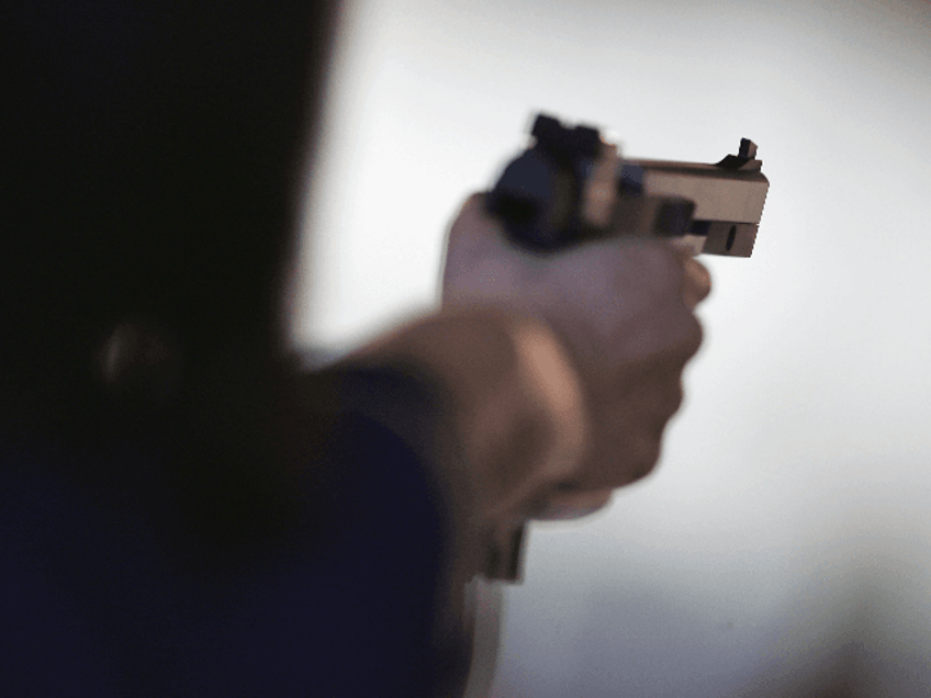 Michiko Fukushima of Japan lines up a shot during the women's 25 metre pistol qualifying e