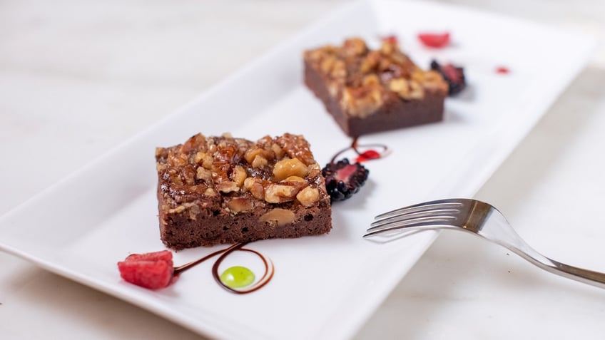 Two Palmer House brownies are arranged on a plate.