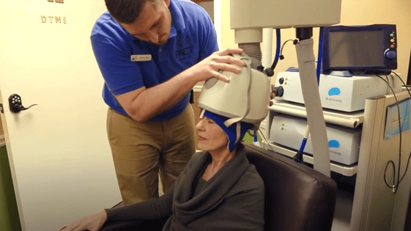 woman receives deep tms treatment