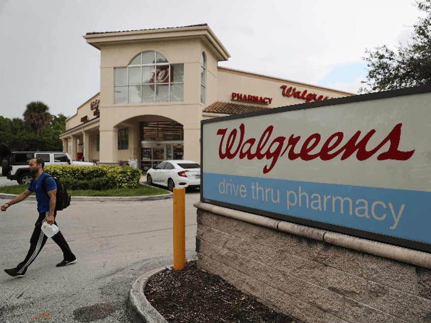 chicago police armed man in critical condition after walgreens employee opens fire