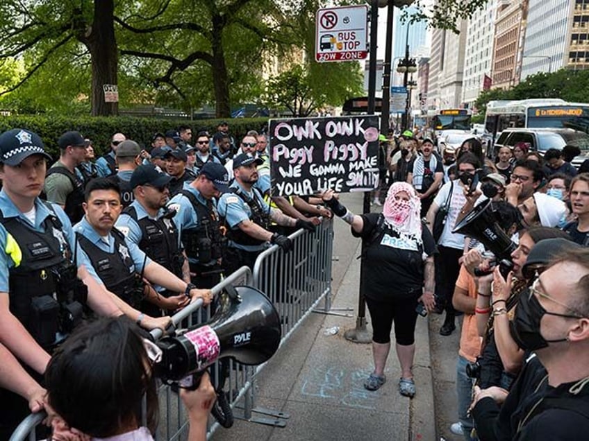 Police stand guard outside of the Art Institute of Chicago after students established a pr