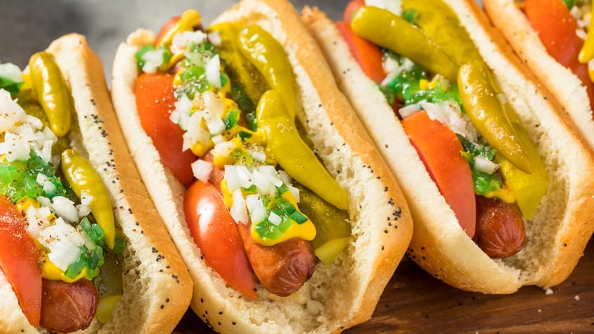 These homemade Chicago-style hot dogs are served with tomatoes, onions and peppers.