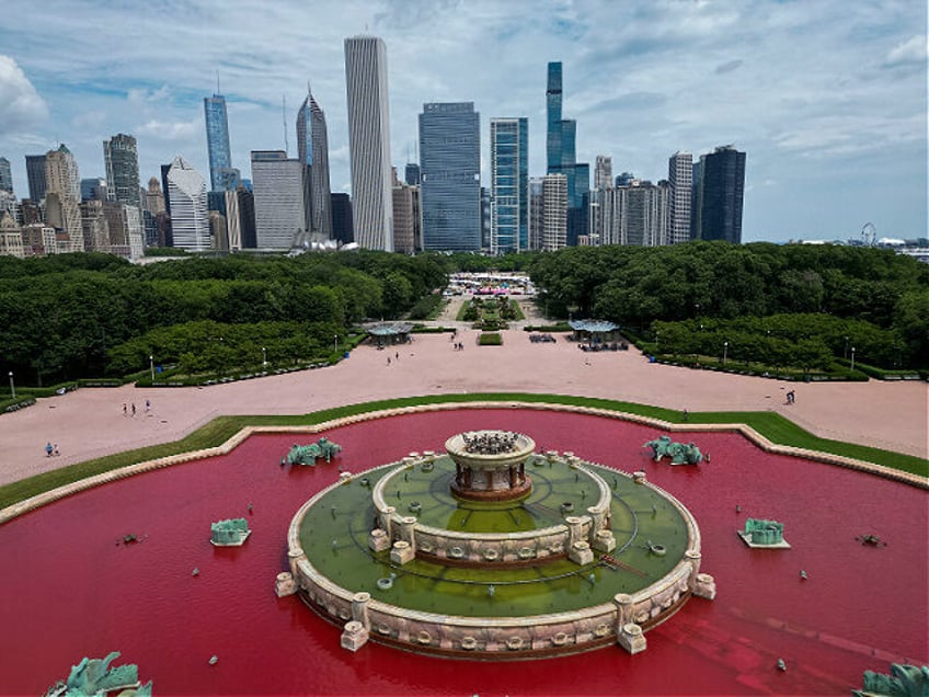 The water in Buckingham Fountain is dyed red by protesters making a statement against the