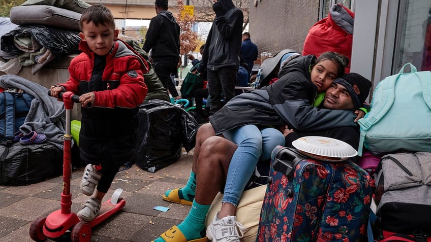 A migrant child on a scooter