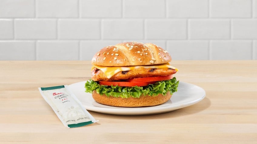 Chick-fil-A's Grilled Spicy Deluxe Sandwich with cilantro lime sauce is shown.